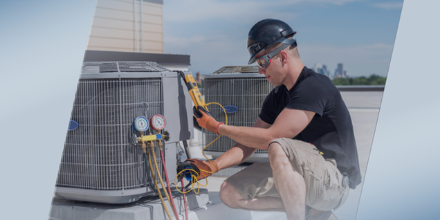 A technician wearing safety gear conducts an assessment with a multimeter, testing rooftop HVAC units on a sunny day, with tools and gauges attached to the equipment.